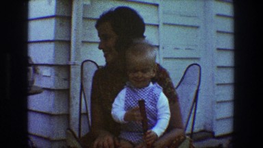 1968: mother holds toddler on lap and cuddles TOLEDO OHIO