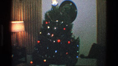 1968: beautifully decorated christmas tree, covered with tassels and lights