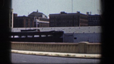 1961: driving on a highway through an industrial area. BALTIMORE MARYLAND