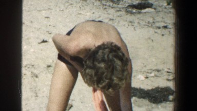 1961: children playing in the sand on a beach. BALTIMORE MARYLAND