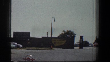 1961: car driving by buildings and farmhouse BALTIMORE MARYLAND