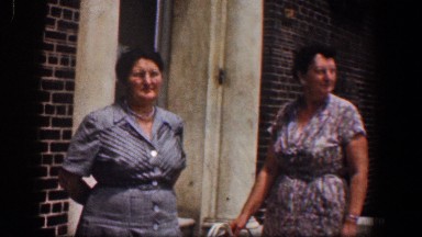 1961: two well dressed women stand in front of a building BALTIMORE MARYLAND