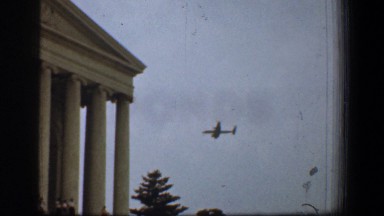 1961: view of an airplane flying past a very large building. WASHINGTON DC