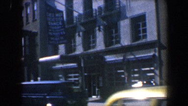 1962: a banner hanging from a balcony of a tall building PHILADELPHIA