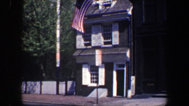 1962: the street of the city with official buildings, vehicles streaming, etc