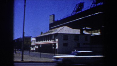 1964: cars driving by a building SAINT LOUIS MISSOURI