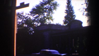 1964: cars driving by building SAINT LOUIS MISSOURI