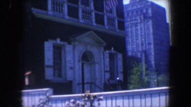 1962: historic looking building with american flag, detailing and white dome