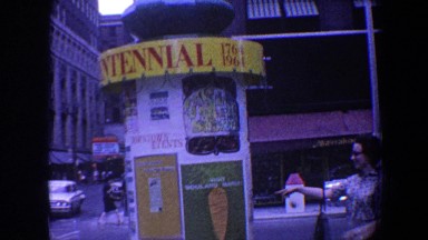 1964: busy city street full of random items and people walking around
