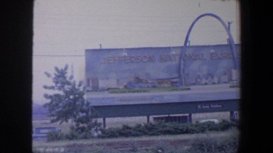 1964: huge memorial sign in the field, standing tall. SAINT LOUIS MISSOURI