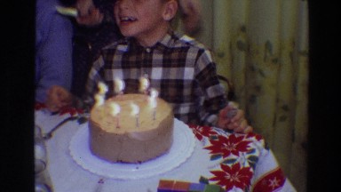 1968: little boy getting ready to blow his candles out on his birthday cake!