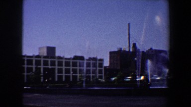 1964: city water fountain sprays dozens of water streams into the air.