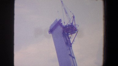 1964: high crane observing fenced area building construction SAINT LOUIS