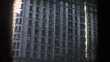 1960: a tall building with trees lining the front of it NEW YORK CITY