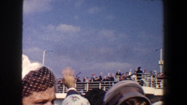 1960: people waving goodbye to their families on a ship. NEW YORK CITY