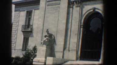 1961: a magnificent building with sculptures, arch doors and stony works.
