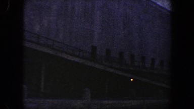 1960: footage of a very tall building that is surrounded by a large, brick wall