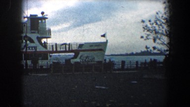1960: passengers wait for launch of the statue of liberty ferry