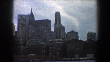 1960: a large city skyline with skyscrapers on the water's edge NEW YORK CITY