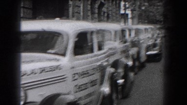 1938: People Getting Out of Parked Cars Along Sidewalk Reading, Pennsylvania