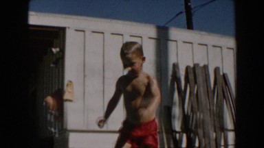 1962: Young Boy Demonstrates Swimming Skills Across Pool in North Hollywood, California