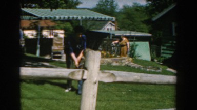 1962: mother helps son with attire at grandmother's house.