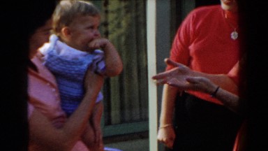 1962: woman wanting to hold the baby. GLENDALE, CALIFORNIA