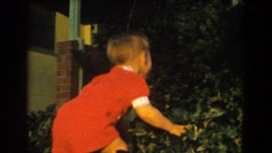 1962: party of kids outside playing and having a grand old time laughing