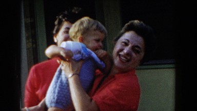 1962: adults giving the toddler some attention. GLENDALE, CALIFORNIA