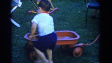 1962: children playing with a little red wagon. GLENDALE, CALIFORNIA