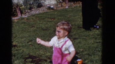 1962: little boy casually walking throughout the yard. GLENDALE, CALIFORNIA