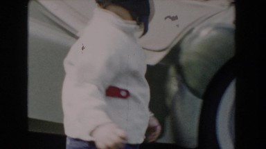 1962: baby open car door GLENDALE, CALIFORNIA