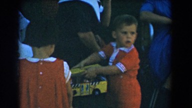1962: celebrating children's birthday party with toys and cake GLENDALE