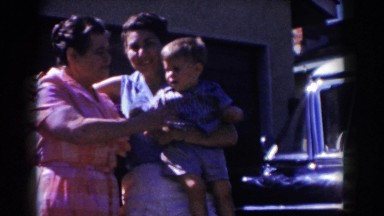 1962: mother and daughter with child in driveway GLENDALE, CALIFORNIA