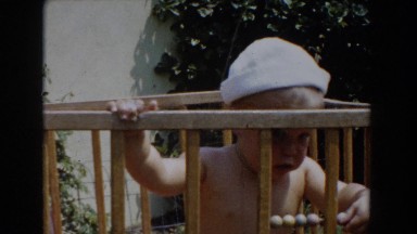1962: little baby playing in playpen. GLENDALE, CALIFORNIA