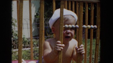 1962: baby crying in his crib GLENDALE, CALIFORNIA