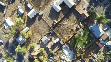 a subdivision with buildings, trees, streets, sidewalk, roofs and plots COLORADO