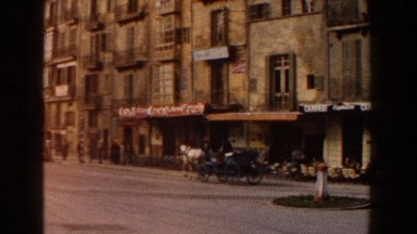 1960: horse driven cart travels down main street