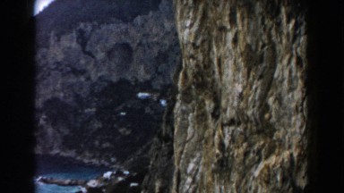 1960: Ocean front mansion on rocky cliffs