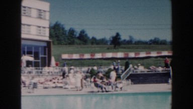 1960: people enjoying a nice day by the pool. MIAMI, FLORIDA