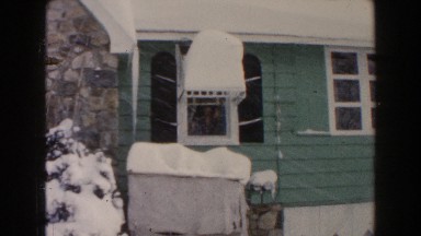 1961: looking out at the new fallen snow. DEARBORN, MICHIGAN