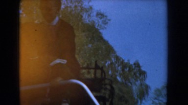 1961: a boy climbing on a ladder while holding a metal pole KNOTTS BERRY FARM