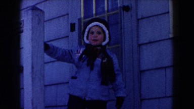 1961: child standing on porch DEARBORN, MICHIGAN