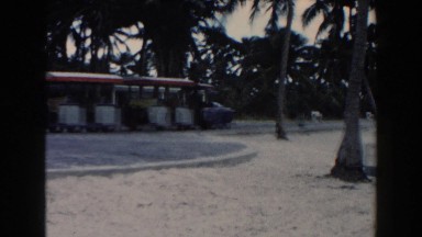 1960: A Golf Cart Pulls Three Empty Passenger Cars Miami, Florida