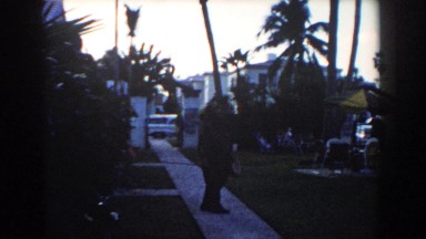 1960: man wasting time on a sidewalk. MIAMI, FLORIDA