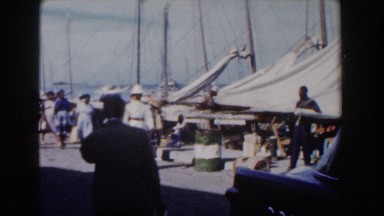 1961: People Walking Around a Port in Nassau, Bahamas