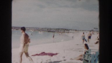 1961: People Walking Alongside the Ocean in Nassau, Bahamas