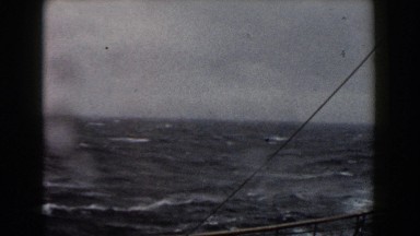 1959: Merchant Ship Sailing Through Choppy Seas
