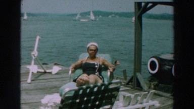 1964: surveying a body of water to see the people and the boats on the water