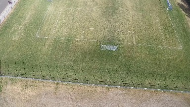 panning over a soccer field from far above COLORADO